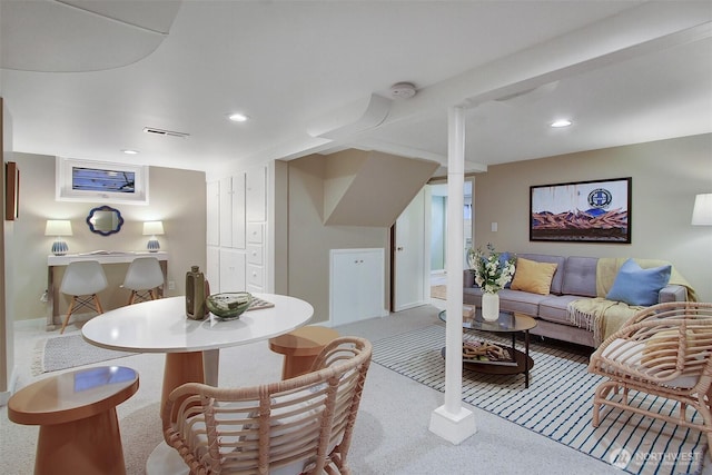 living area with recessed lighting, visible vents, and light colored carpet