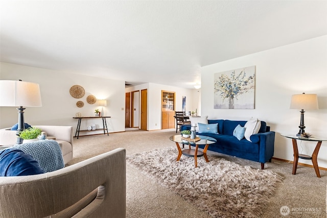 living room featuring baseboards and carpet floors