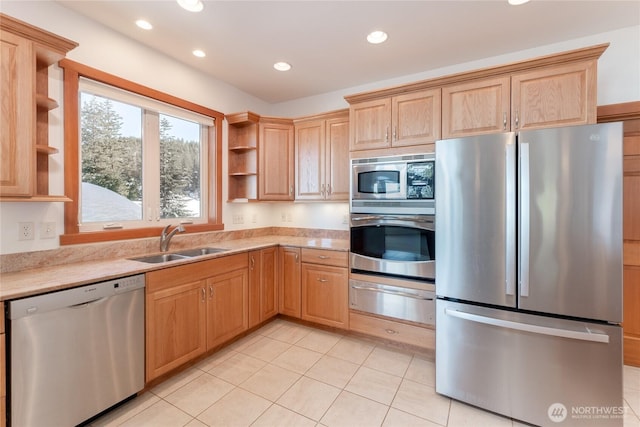 kitchen featuring stainless steel appliances, a warming drawer, open shelves, a sink, and recessed lighting