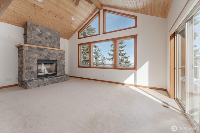 unfurnished living room featuring carpet, a fireplace, wood ceiling, high vaulted ceiling, and baseboards