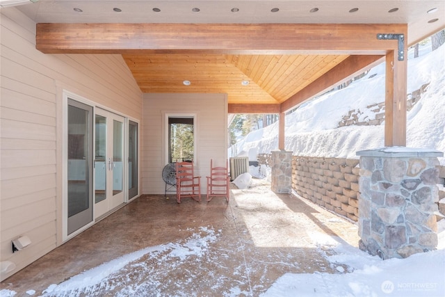 snow covered patio with french doors