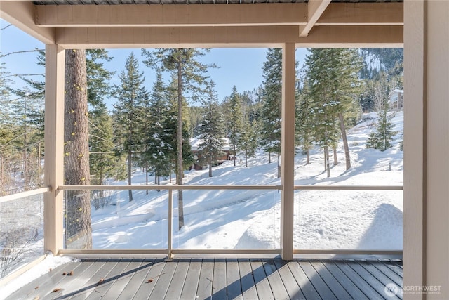 unfurnished sunroom featuring a wealth of natural light