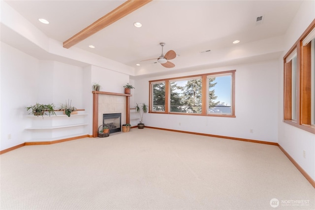 unfurnished living room featuring recessed lighting, a ceiling fan, carpet flooring, a tile fireplace, and baseboards