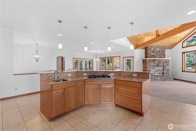 6760 Forest Ridge Dr, Wenatchee, WA 98801 - kitchen featuring a fireplace, light tile patterned flooring, recessed lighting, a chandelier, and lofted ceiling