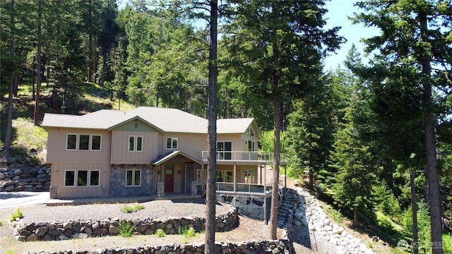 6760 Forest Ridge Dr, Wenatchee, WA 98801 - view of front of house featuring stone siding, a porch, and board and batten siding