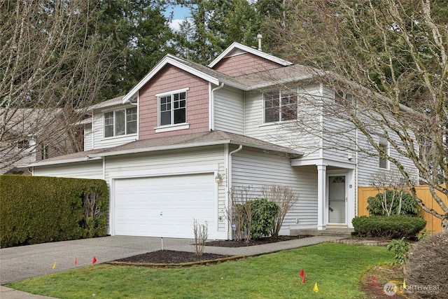 view of front of property with a garage, driveway, a front yard, and fence