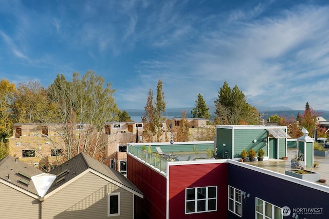 exterior space with a residential view and a balcony