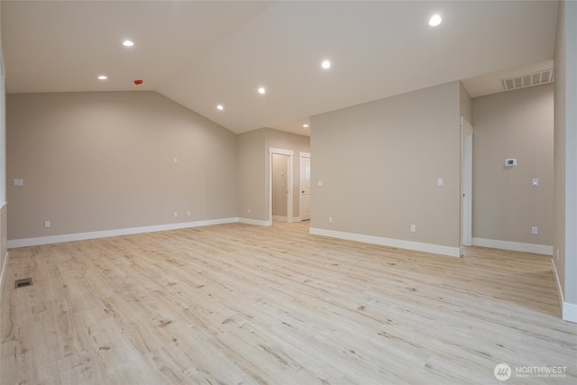 spare room featuring light wood-type flooring, visible vents, and recessed lighting