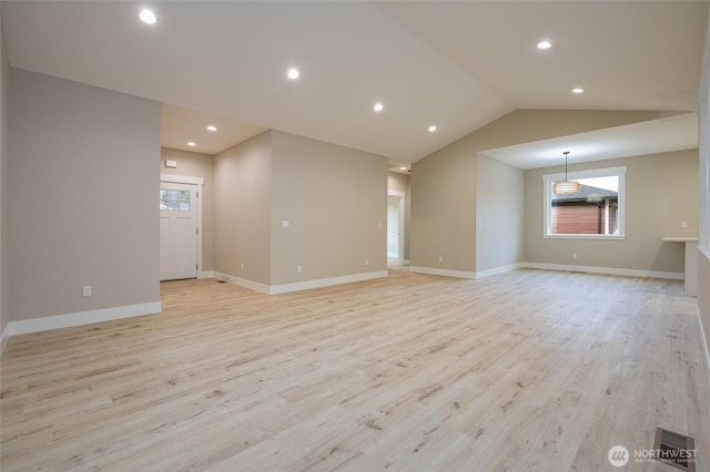 unfurnished living room featuring recessed lighting, a healthy amount of sunlight, and light wood-type flooring