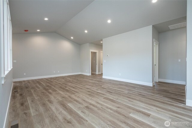 6511 Watson Loop, Maple Falls, WA 98266 - empty room with recessed lighting, baseboards, light wood finished floors, and lofted ceiling