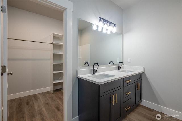 6511 Watson Loop, Maple Falls, WA 98266 - full bathroom with wood finished floors, double vanity, and baseboards