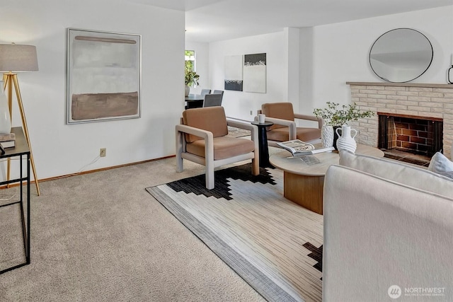 living room featuring a fireplace, baseboards, and carpet floors