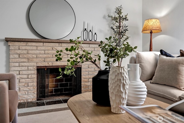 living room featuring a brick fireplace