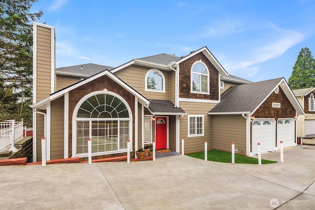 view of front of property with a garage, driveway, a chimney, and roof with shingles