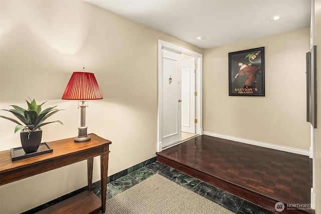 entrance foyer with recessed lighting and baseboards