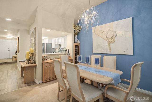 dining room with recessed lighting, a notable chandelier, and baseboards