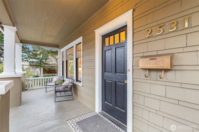 property entrance with covered porch