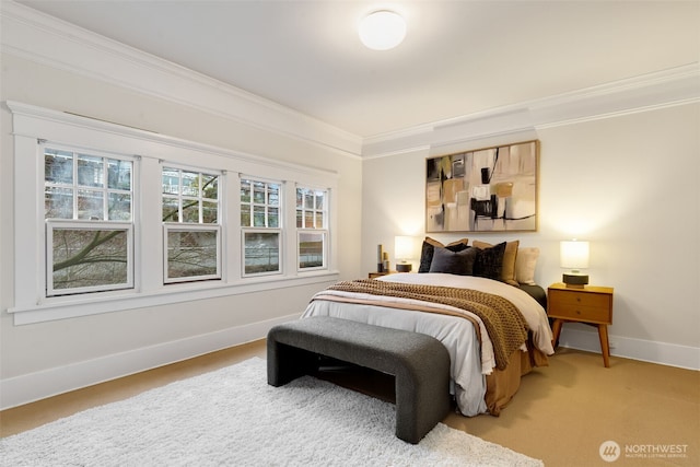 bedroom with carpet, crown molding, and baseboards