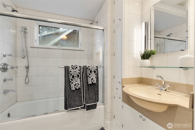 full bath with crown molding, shower / bath combination with glass door, and vanity