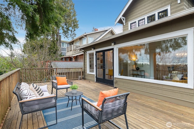 wooden deck featuring french doors and an outdoor hangout area