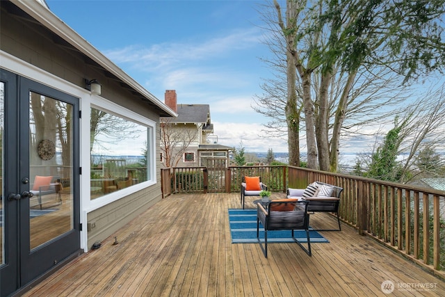 deck featuring outdoor lounge area