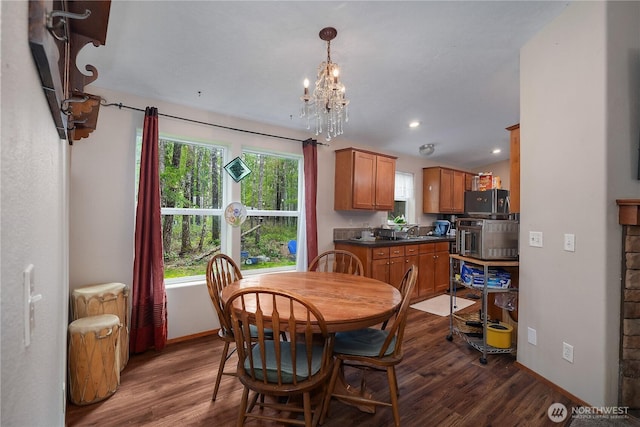 dining room featuring dark wood-style floors, baseboards, a chandelier, and recessed lighting