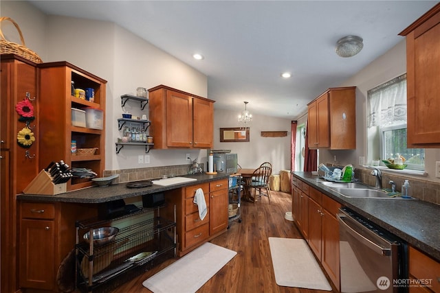 kitchen featuring open shelves, dark countertops, lofted ceiling, a sink, and dishwasher