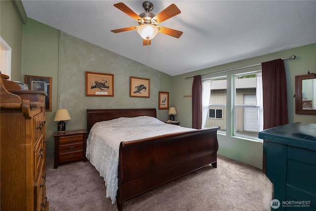 bedroom with lofted ceiling, ceiling fan, and carpet floors