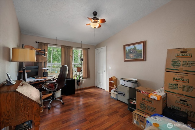 home office featuring lofted ceiling, ceiling fan, a textured ceiling, and wood finished floors