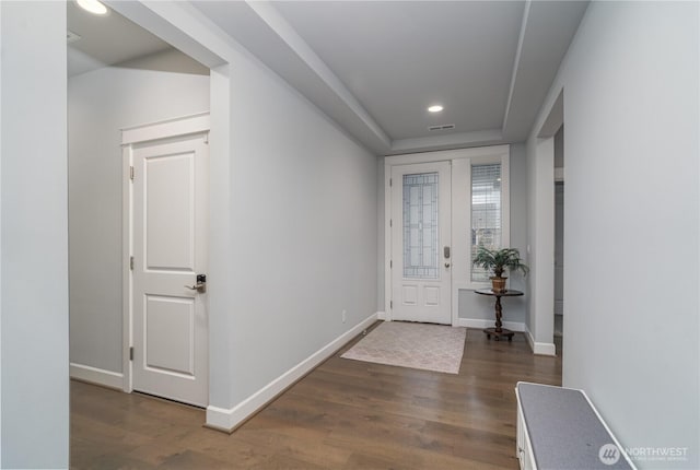 foyer featuring recessed lighting, visible vents, baseboards, and wood finished floors