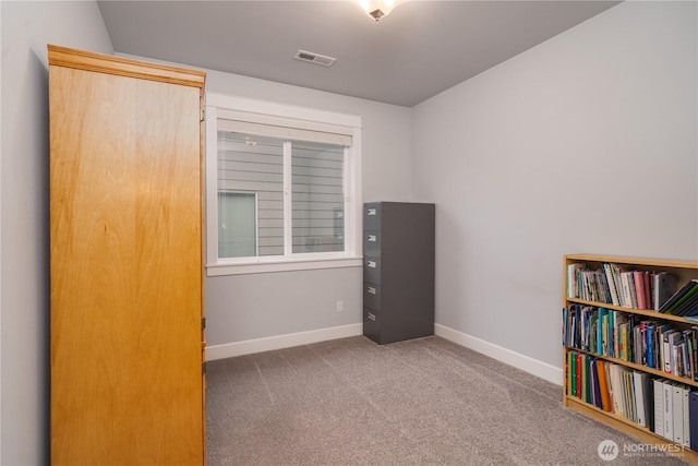 interior space with carpet, visible vents, and baseboards