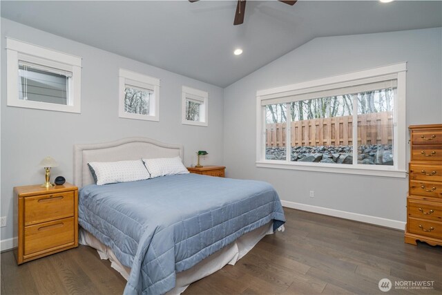 bedroom featuring a ceiling fan, baseboards, vaulted ceiling, and wood finished floors