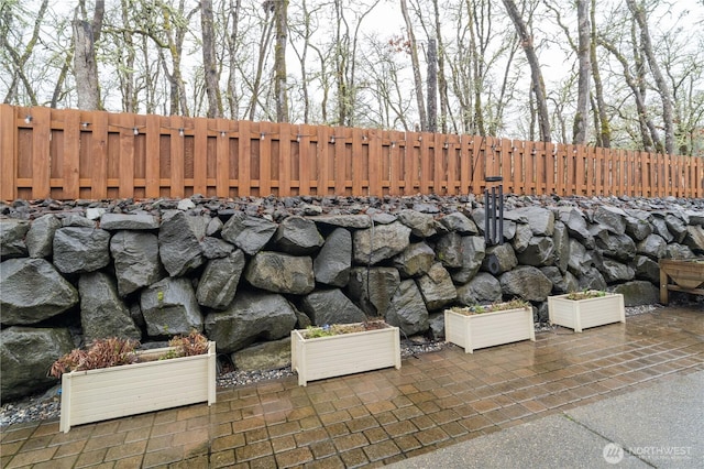 exterior details with a fenced backyard