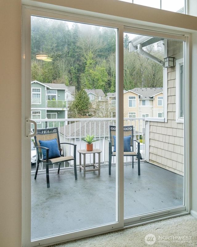 doorway to outside featuring concrete flooring