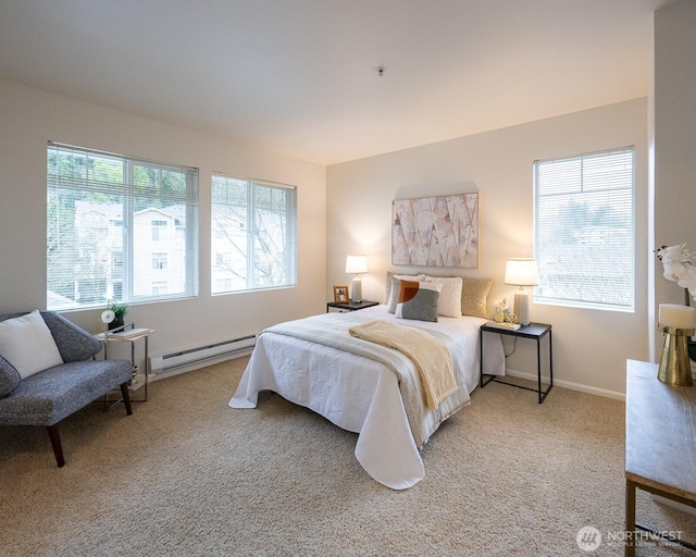 bedroom featuring a baseboard radiator, baseboards, and carpet