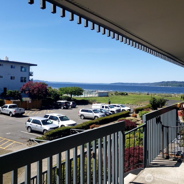 balcony featuring a water view