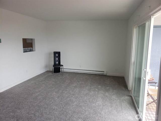 unfurnished room with carpet flooring and baseboard heating