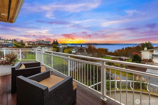 balcony featuring a water view