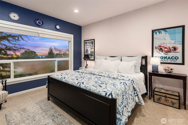 carpeted bedroom with baseboards