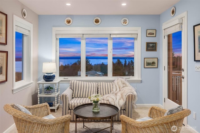 living area with baseboards, carpet flooring, and recessed lighting