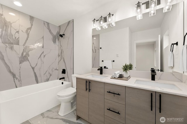 full bath featuring toilet, marble finish floor, a sink, and washtub / shower combination