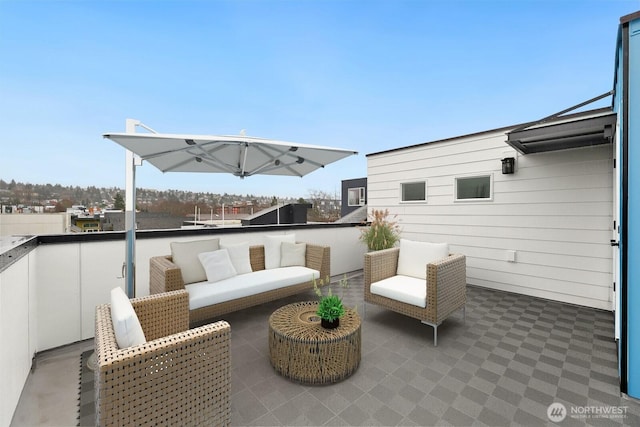 view of patio / terrace with a balcony and outdoor lounge area