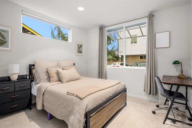 bedroom featuring recessed lighting, baseboards, and light colored carpet