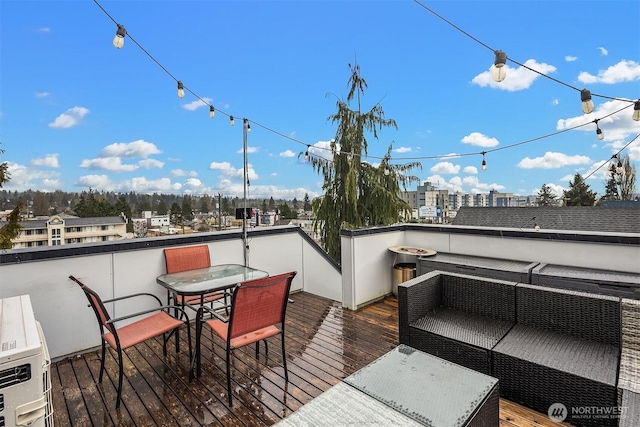 wooden terrace featuring outdoor dining area