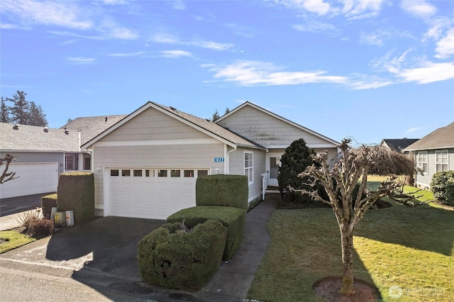 ranch-style house with a front yard, driveway, and an attached garage