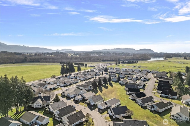 birds eye view of property featuring a residential view and a water and mountain view