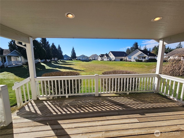 wooden terrace with a residential view