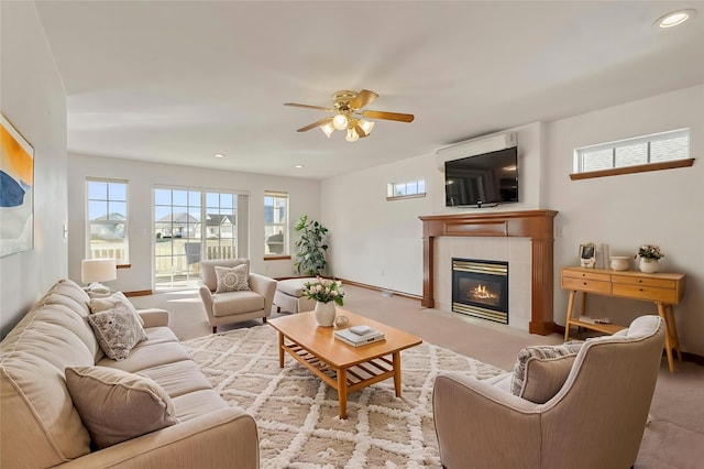 carpeted living room featuring recessed lighting, baseboards, ceiling fan, and a tile fireplace