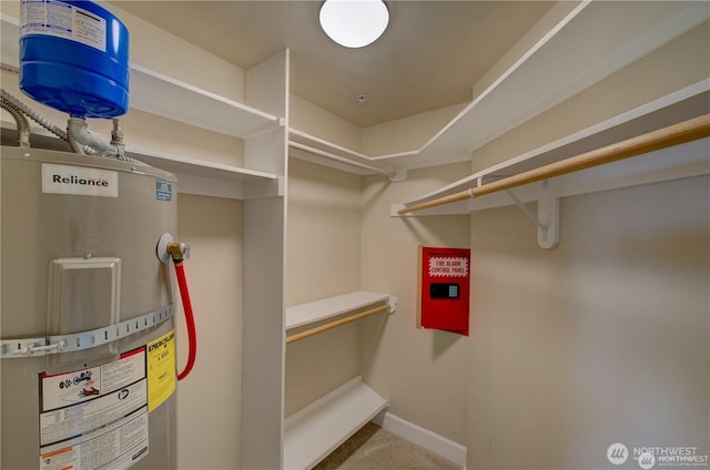 spacious closet featuring water heater