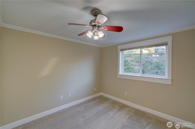 unfurnished room with baseboards, crown molding, and light colored carpet